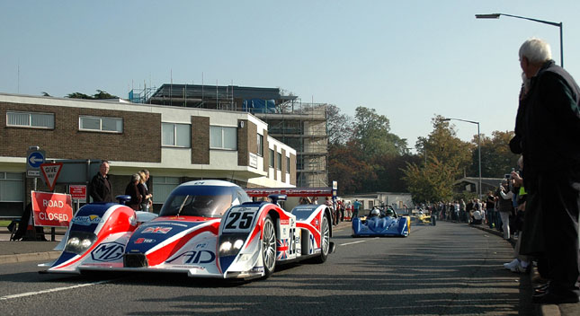 The RML MG Lola EX265C heads the parade through Huntingdon to begin Lola's 50th anniversary celebrations